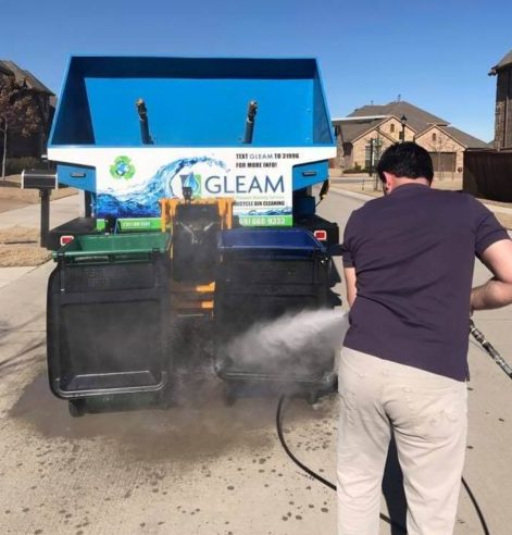 A Pressure Washing Tech Cleans a Driveway